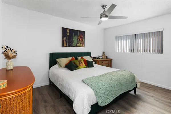 a bedroom with bed and window