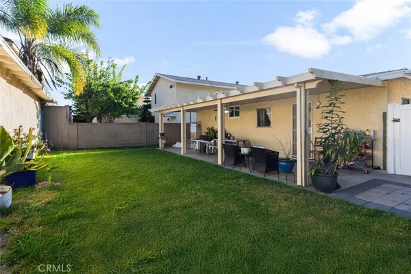 a view of an house with backyard space and garden