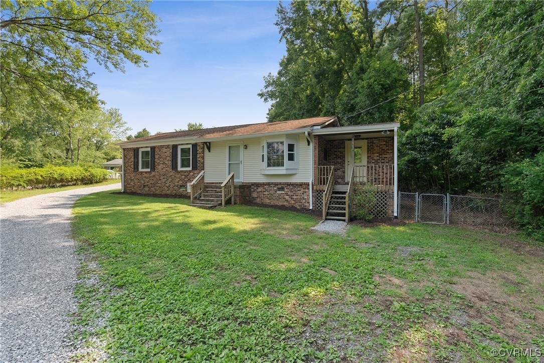 2957 Broad St Road Gum Spring, VA 23065 - Photo 4 of 36 a view of a house with a backyard