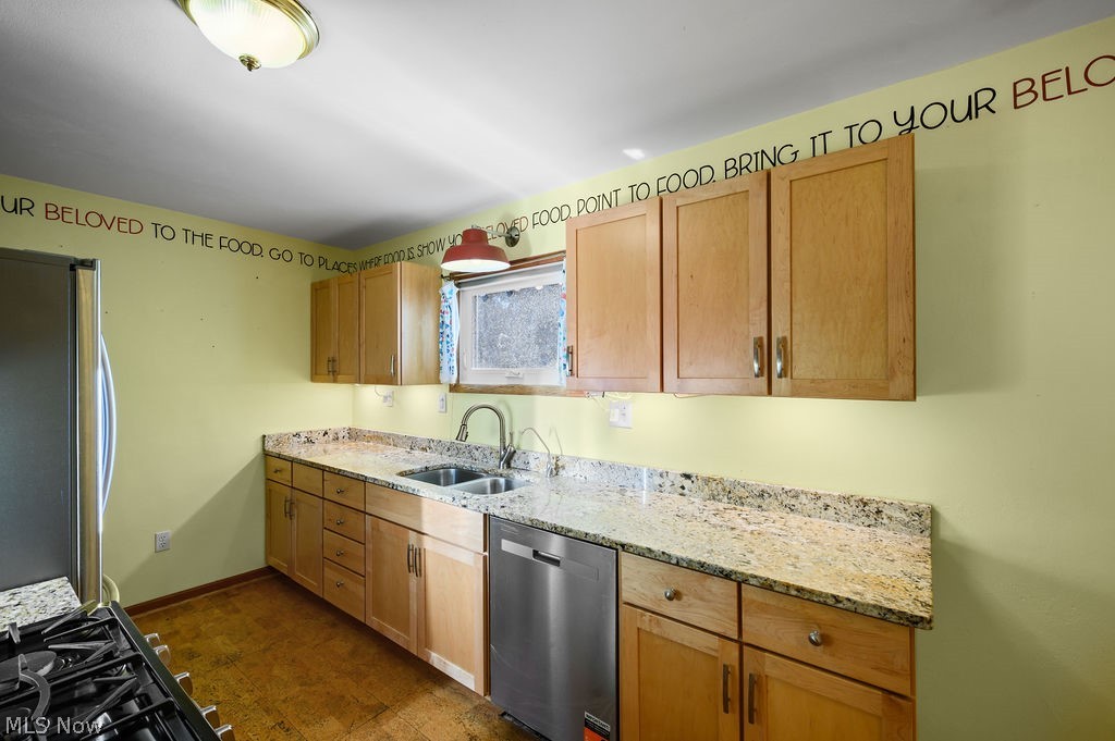 11363 Dupont Road Washington, WV 26181 - Photo 9 of 42 Wood-finish flooring, light wood cabinetry, stone countertops, stainless steel sink with gooseneck faucet, and a stainless steel dishwasher