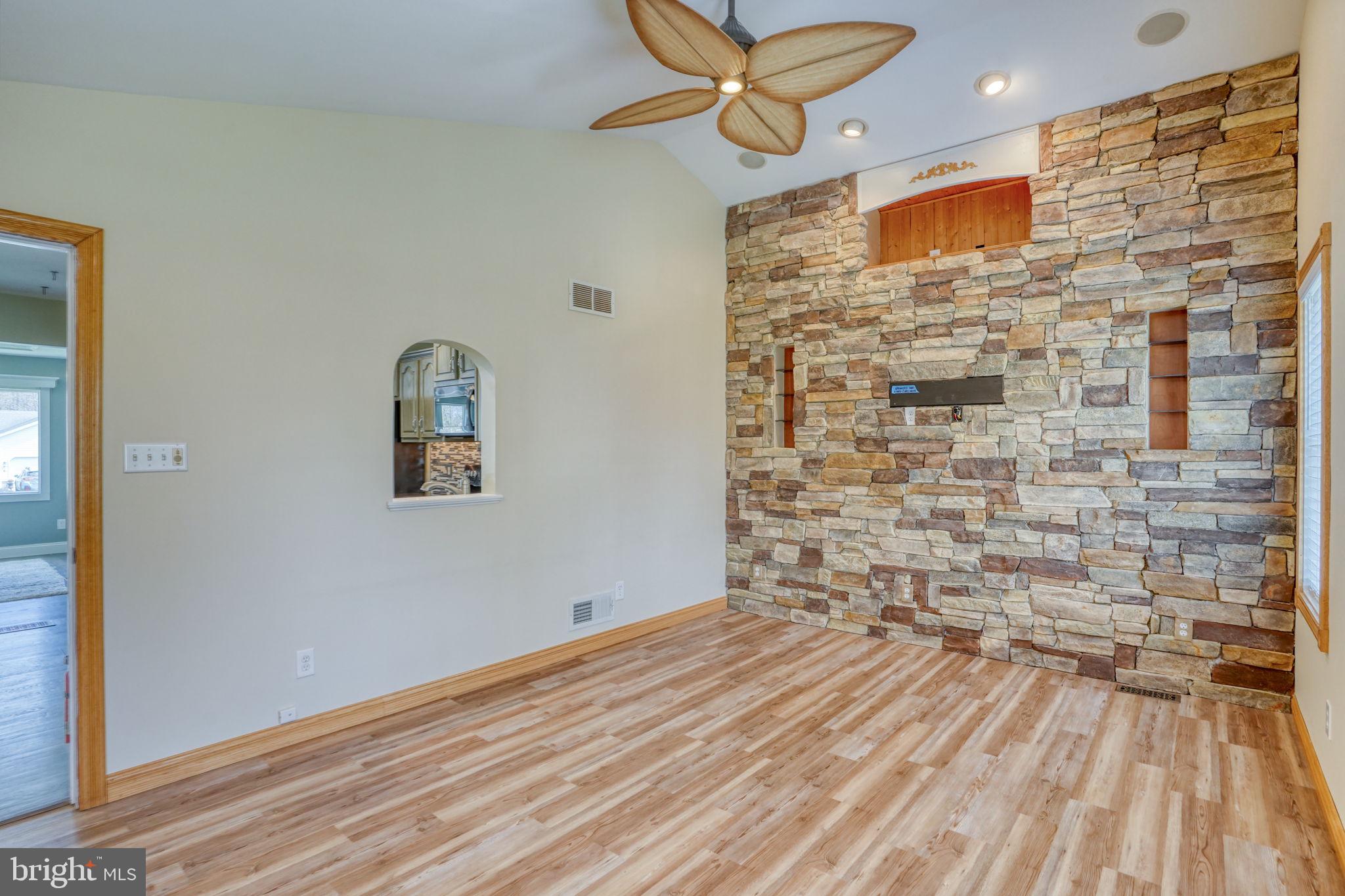 5 Kings Court Elkton, MD 21921 - Photo 12 of 47 a view of empty room with wooden floor and ceiling fan