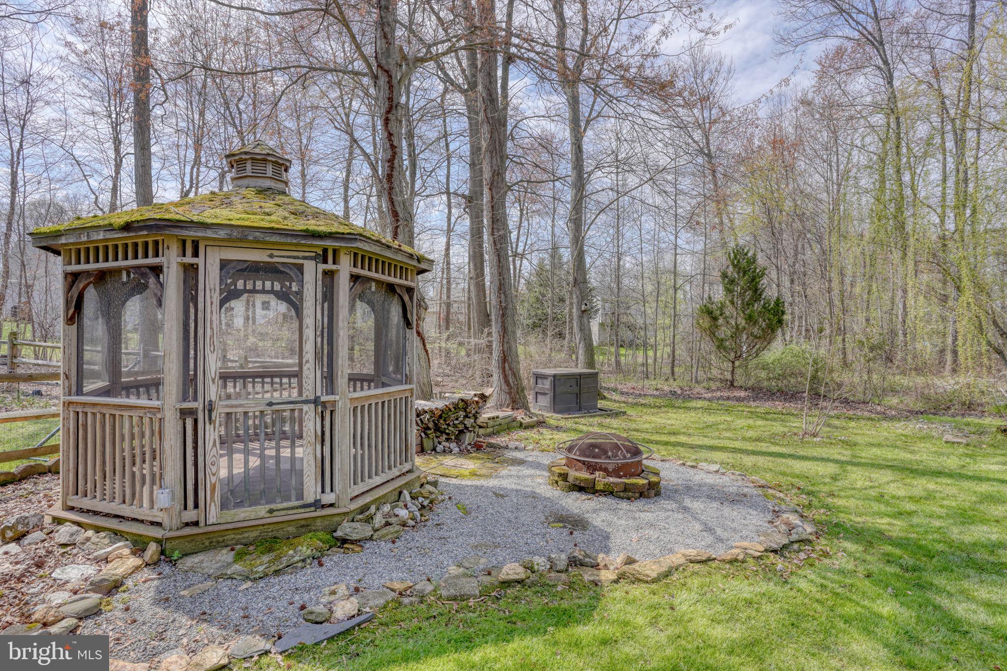 5 Kings Court Elkton, MD 21921 - Photo 15 of 47 a view of a wooden house with a yard and large trees