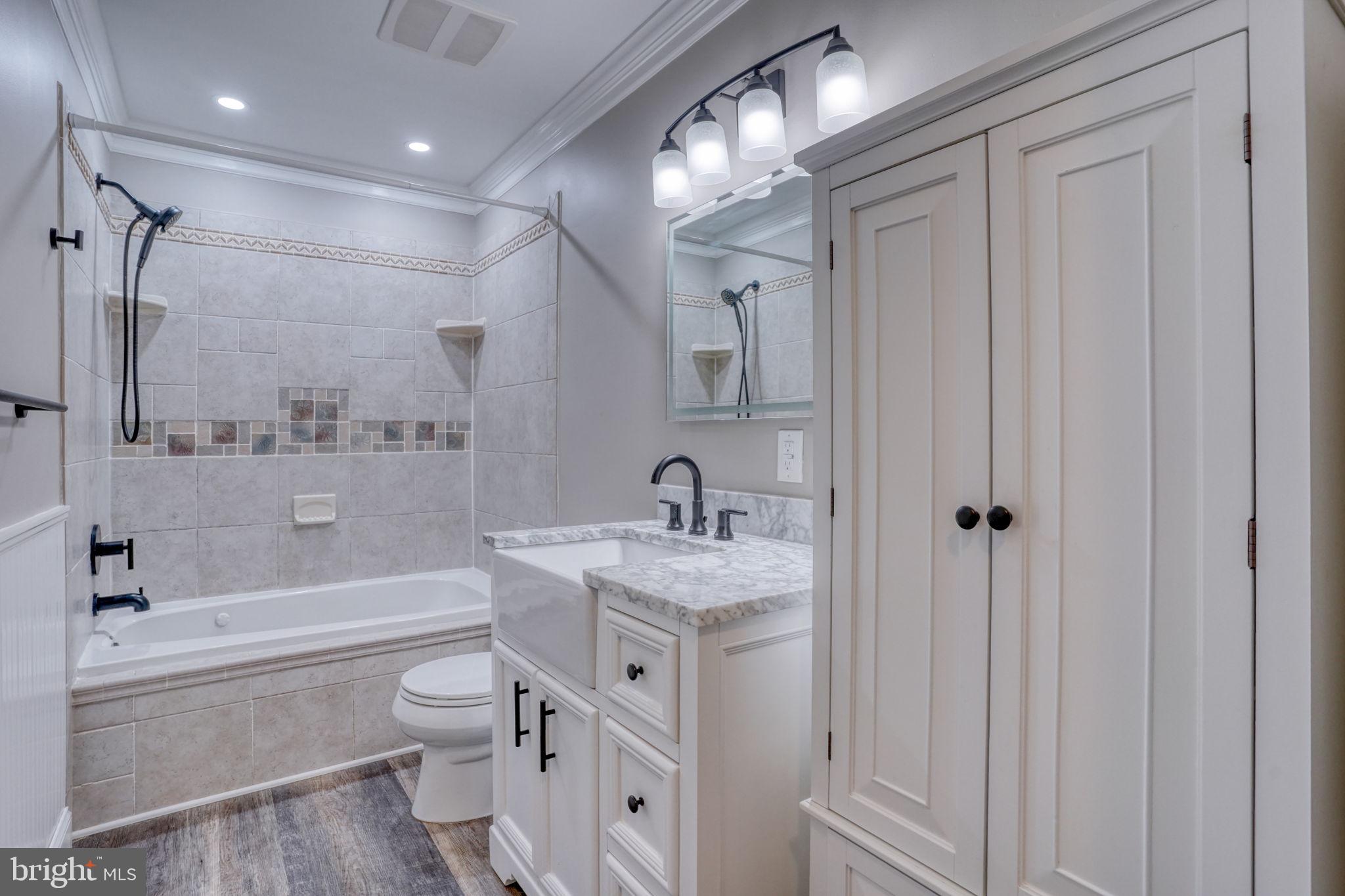 5 Kings Court Elkton, MD 21921 - Photo 18 of 47 a bathroom with a granite countertop sink a toilet and shower