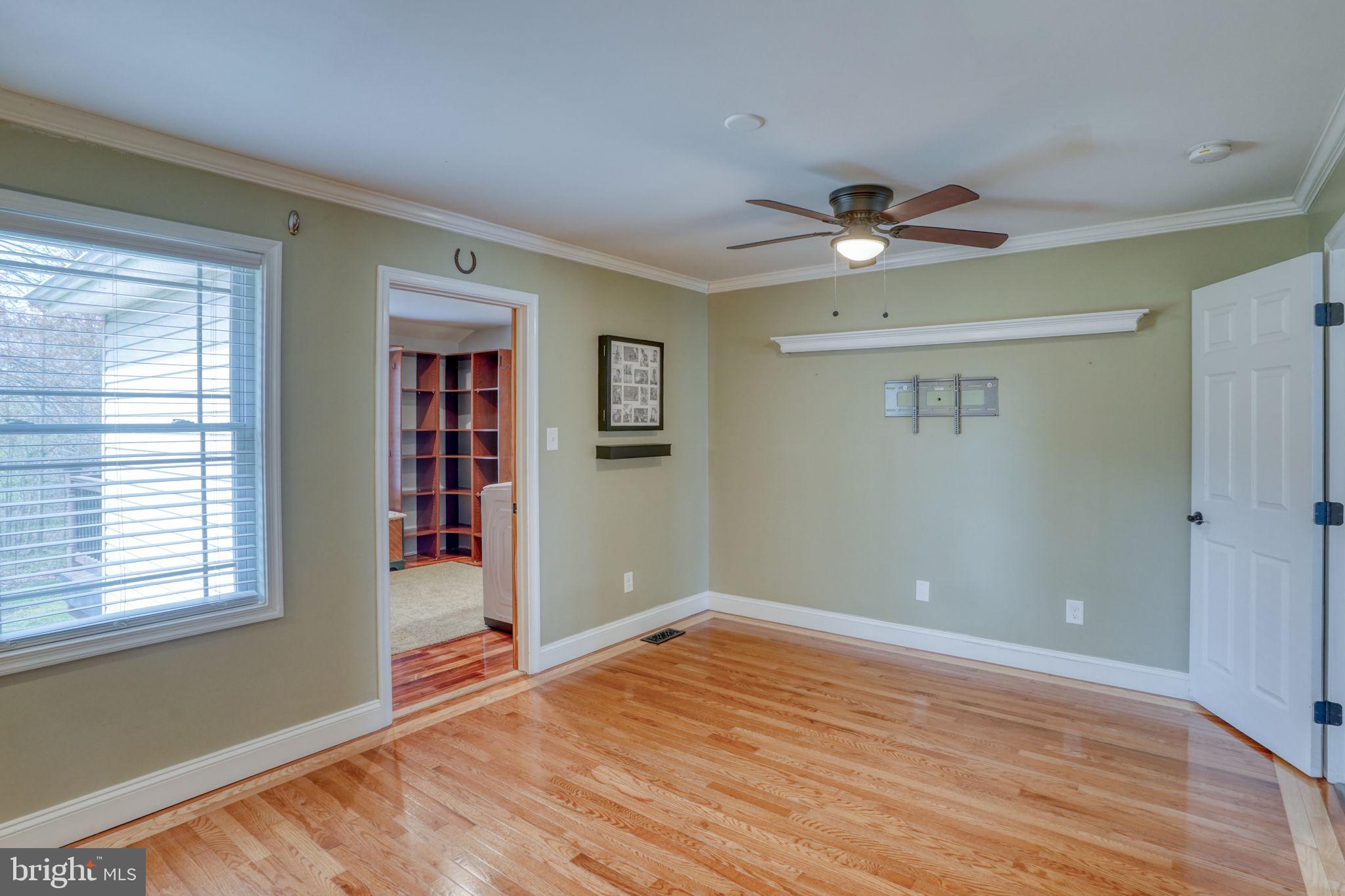 5 Kings Court Elkton, MD 21921 - Photo 20 of 47 a view of empty room with wooden floor and fan