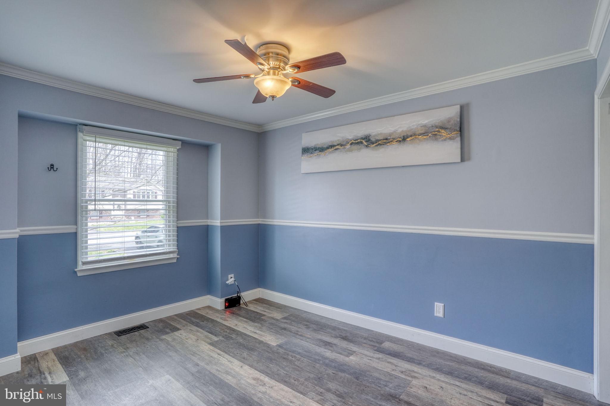 5 Kings Court Elkton, MD 21921 - Photo 26 of 47 a view of an empty room with window and chandelier fan