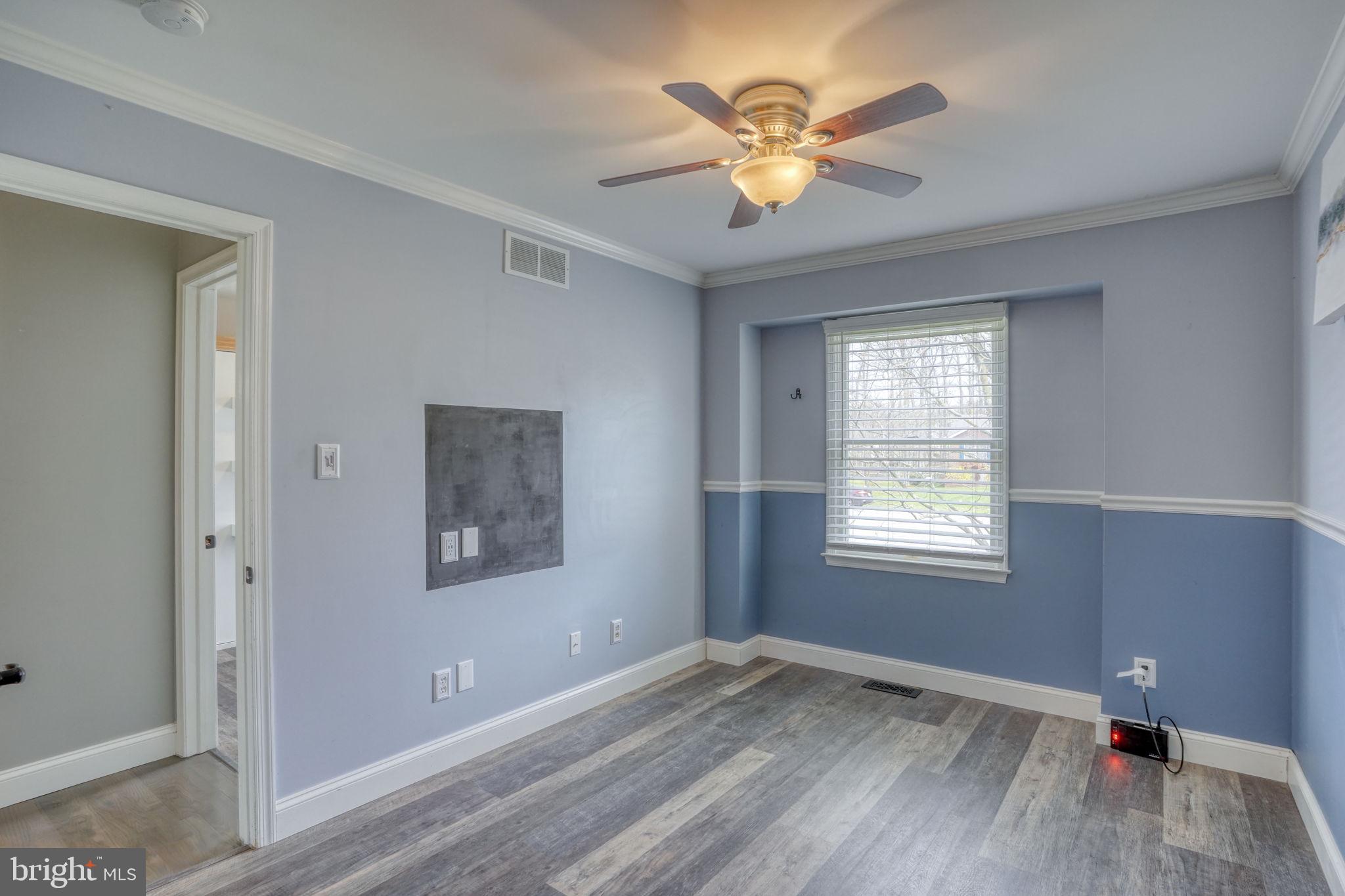 5 Kings Court Elkton, MD 21921 - Photo 27 of 47 a view of an empty room with a window and wooden floor