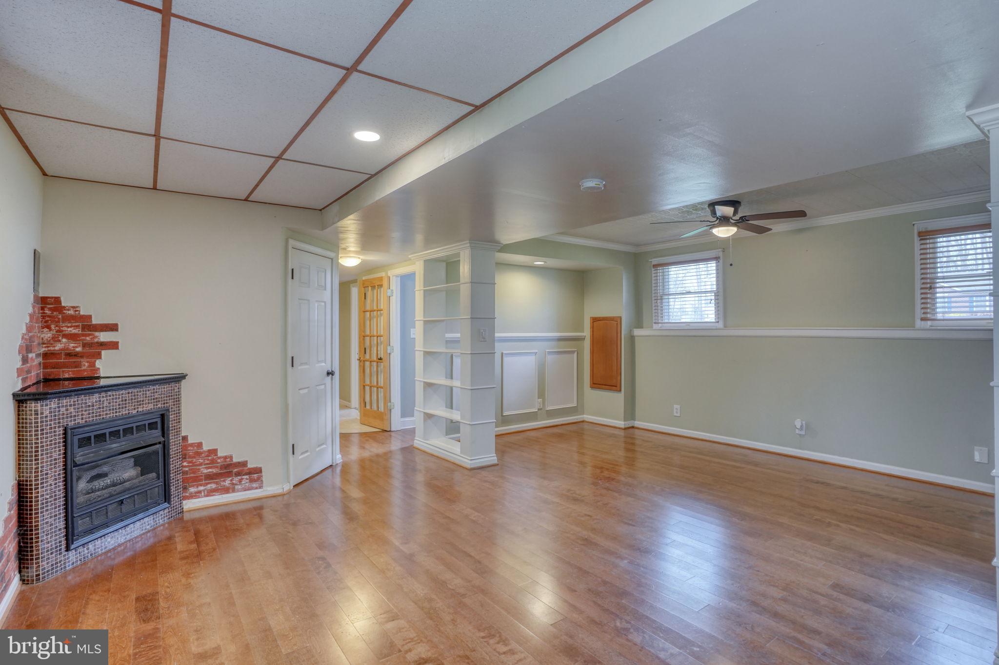 5 Kings Court Elkton, MD 21921 - Photo 31 of 47 a view of an empty room with wooden floor and a fireplace