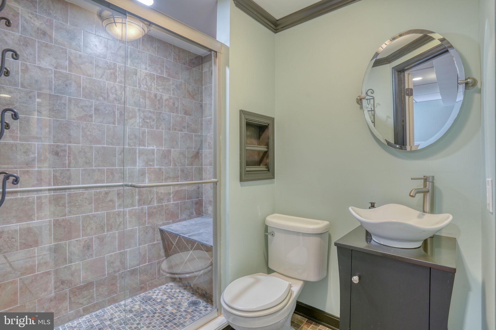 5 Kings Court Elkton, MD 21921 - Photo 33 of 47 a bathroom with a toilet a sink and mirror