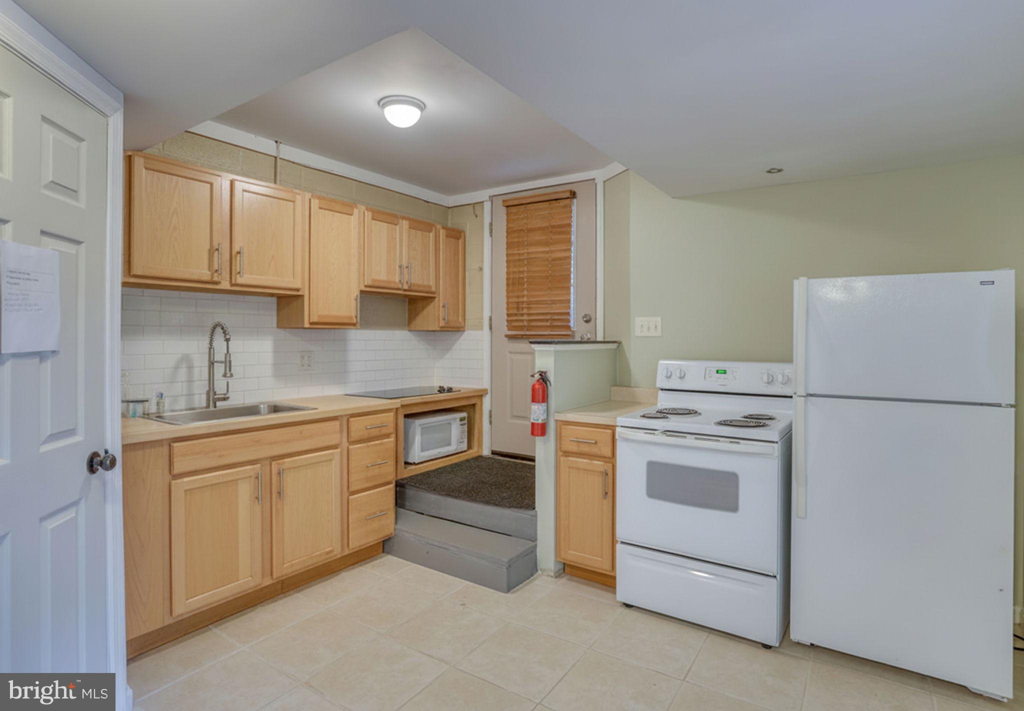 5 Kings Court Elkton, MD 21921 - Photo 40 of 47 a kitchen with a stove sink and refrigerator