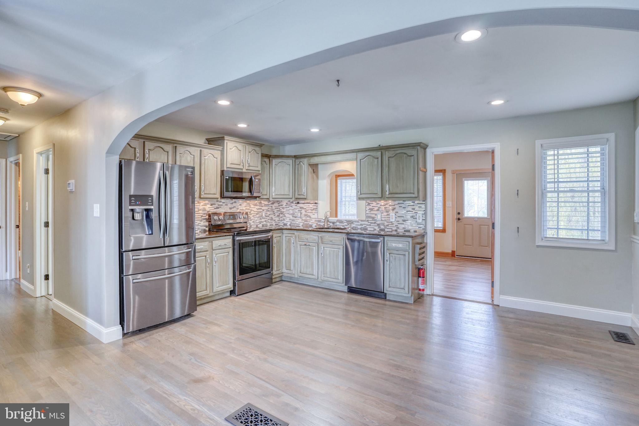 5 Kings Court Elkton, MD 21921 - Photo 6 of 47 a large kitchen with a refrigerator and a stove top oven