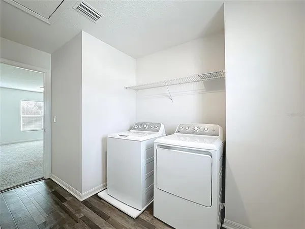 a utility room with dryer and washer