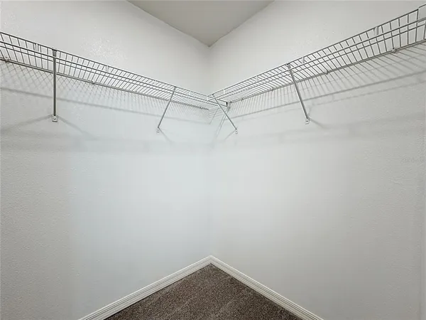 a view of a room with racks on the wall