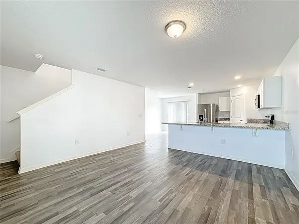 a view of kitchen with wooden floor