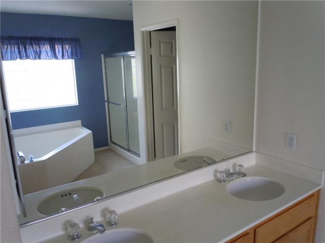2356 Hyacinth Road Alpine, CA 91901 - Photo 12 of 16 Master Bathroom with dual sinks and seperate large tub and shower area.