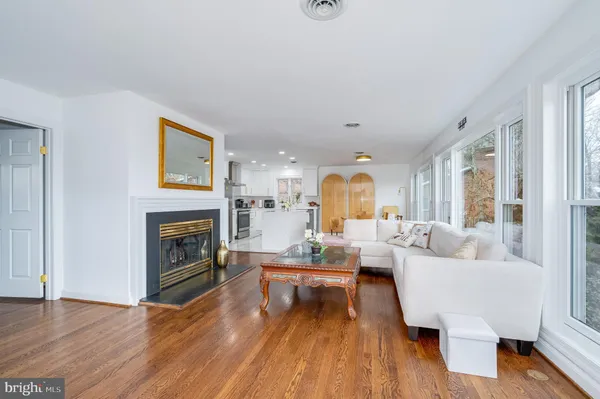 a kitchen with stainless steel appliances granite countertop a stove a microwave and cabinets