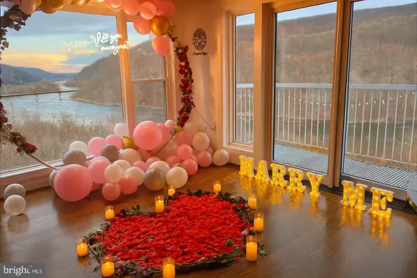 a living room with a window and a wooden floor