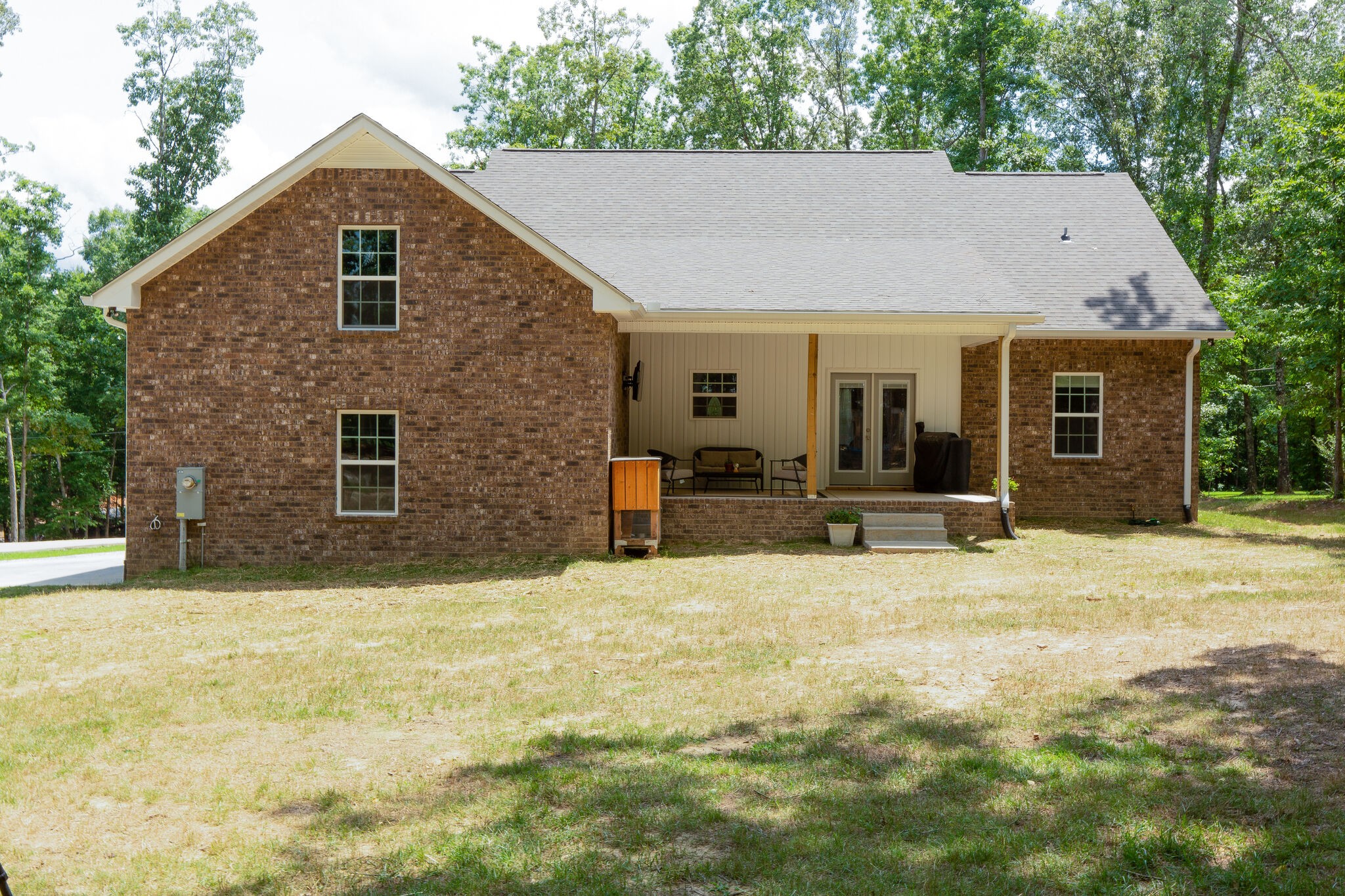 1079 Garton Road Burns, TN 37029 - Photo 24 of 25 a backyard of a house with yard and outdoor seating