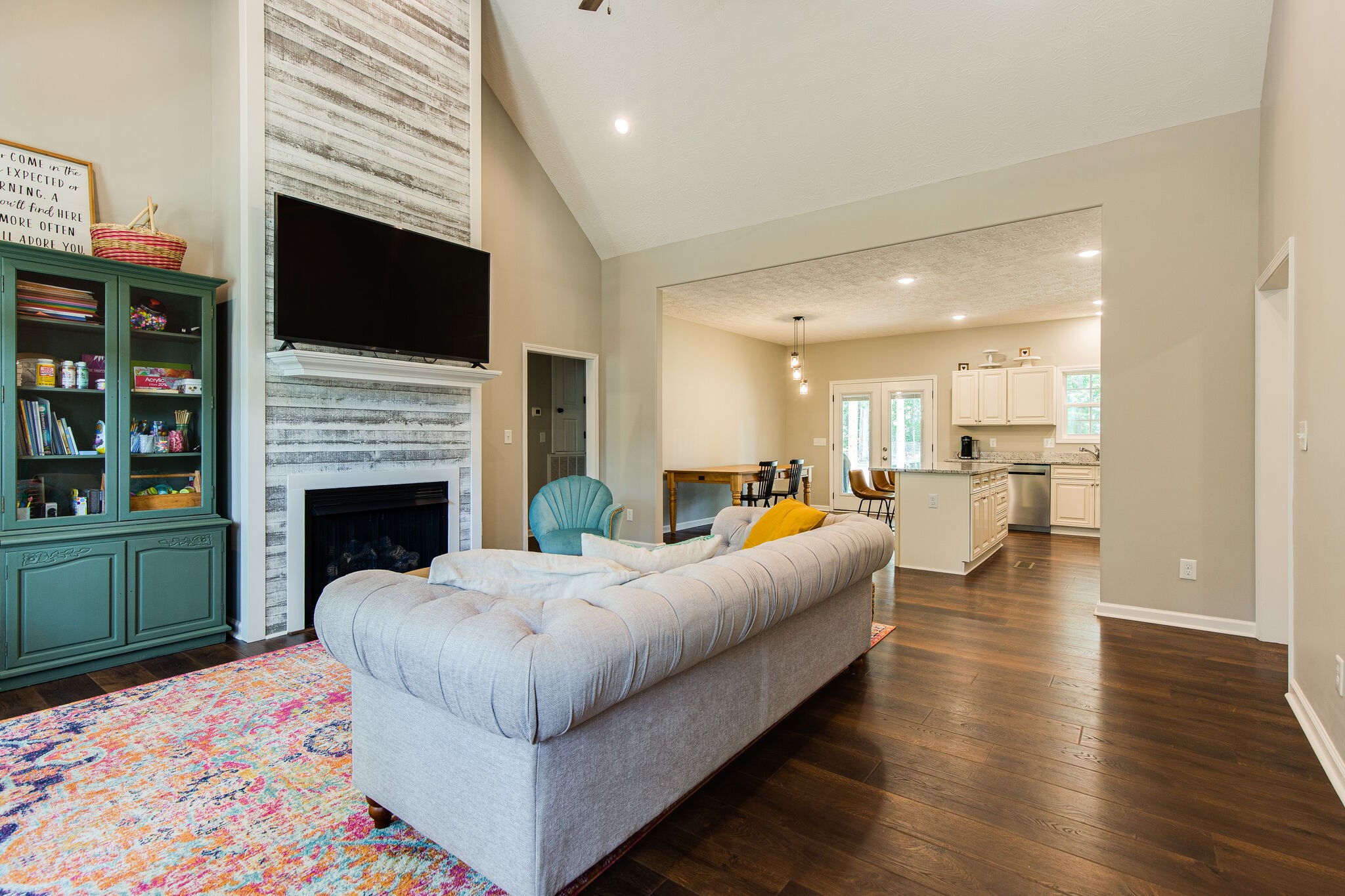 1079 Garton Road Burns, TN 37029 - Photo 6 of 25 a living room with furniture a fireplace and a flat screen tv