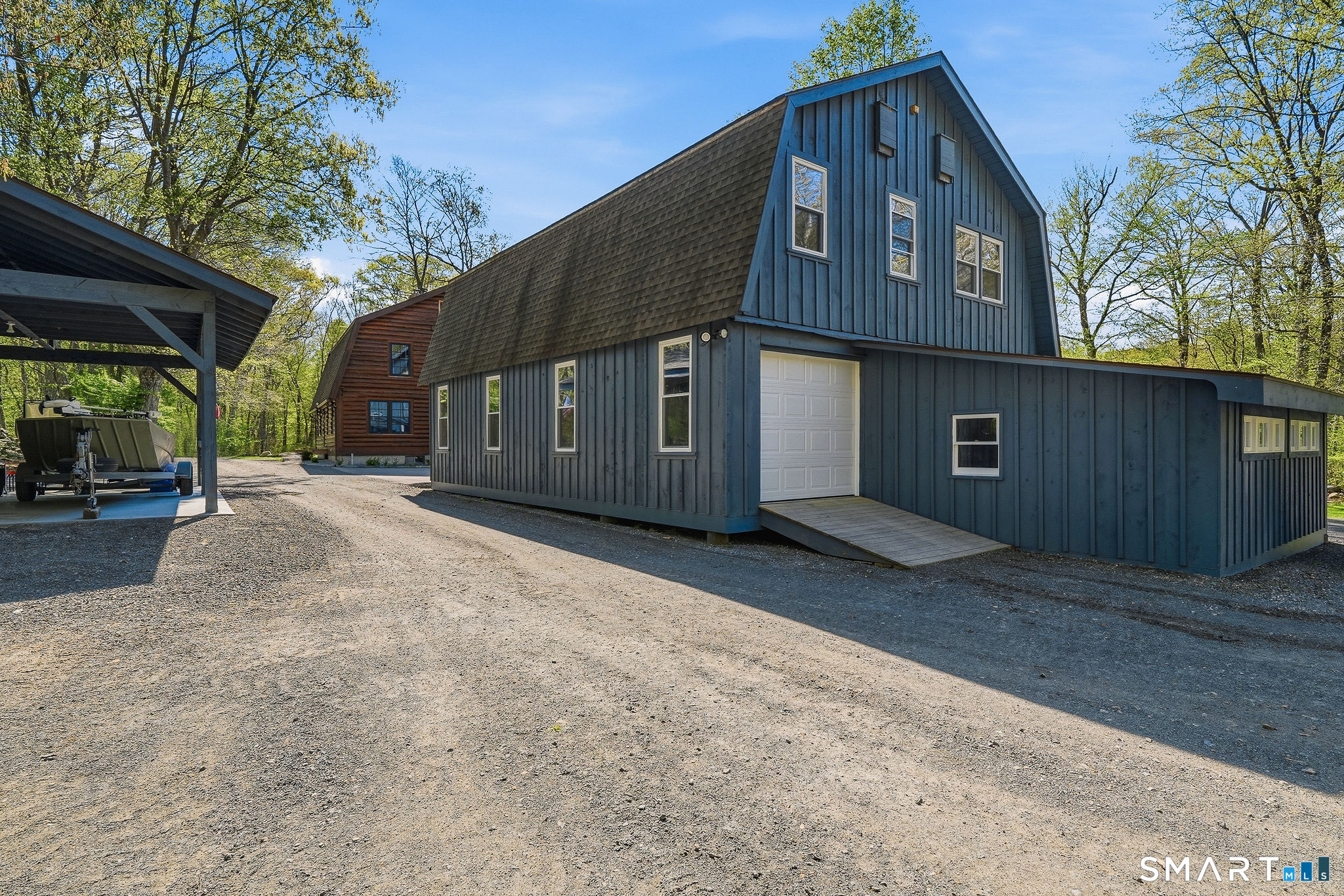 61 Mystic Road North Stonington, CT 06359 - Photo 35 of 40 a front view of a house with a yard