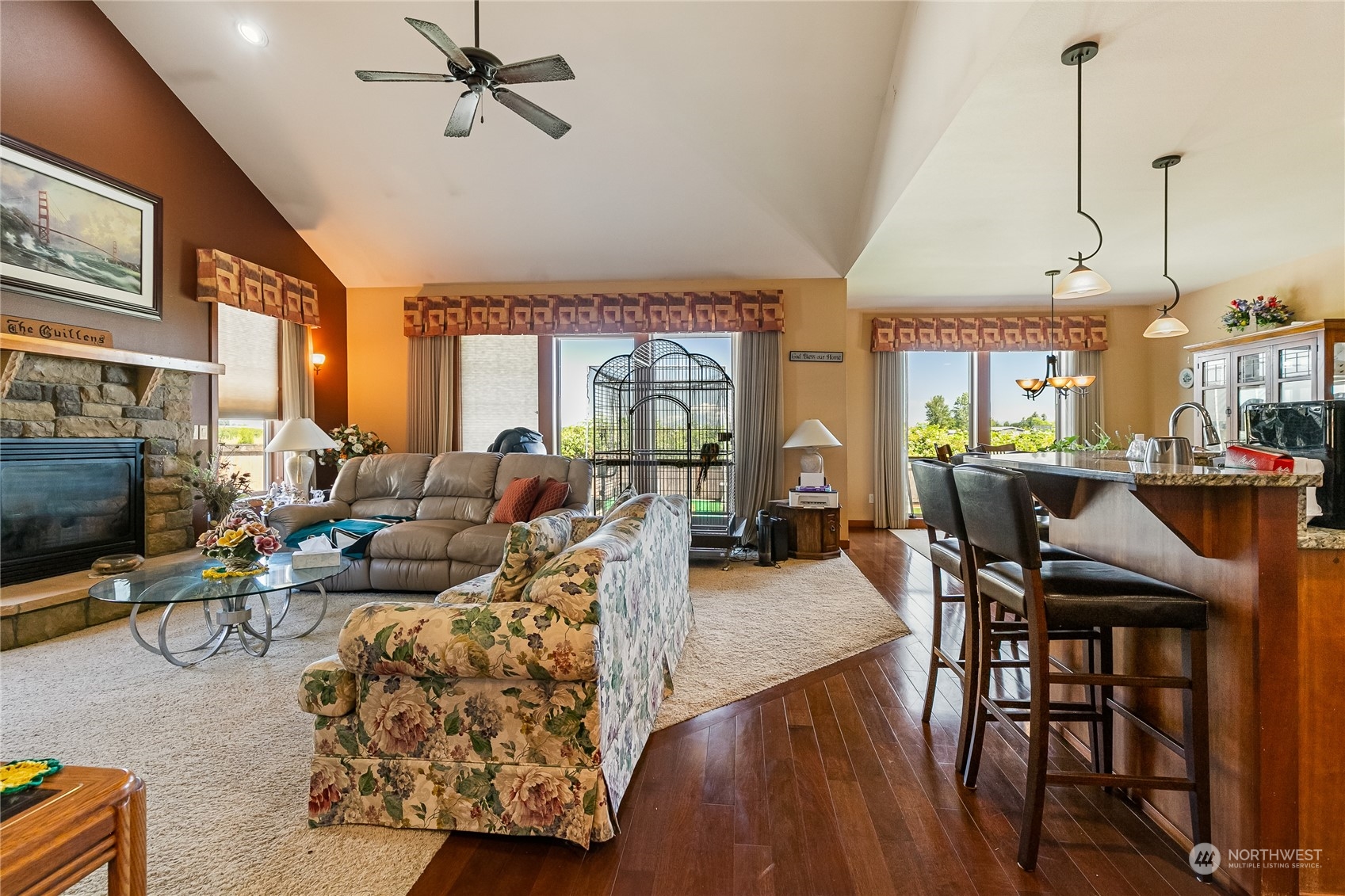 1524 Westview Circle Lynden, WA 98264 - Photo 16 of 30 a living room with furniture a fireplace and a flat screen tv