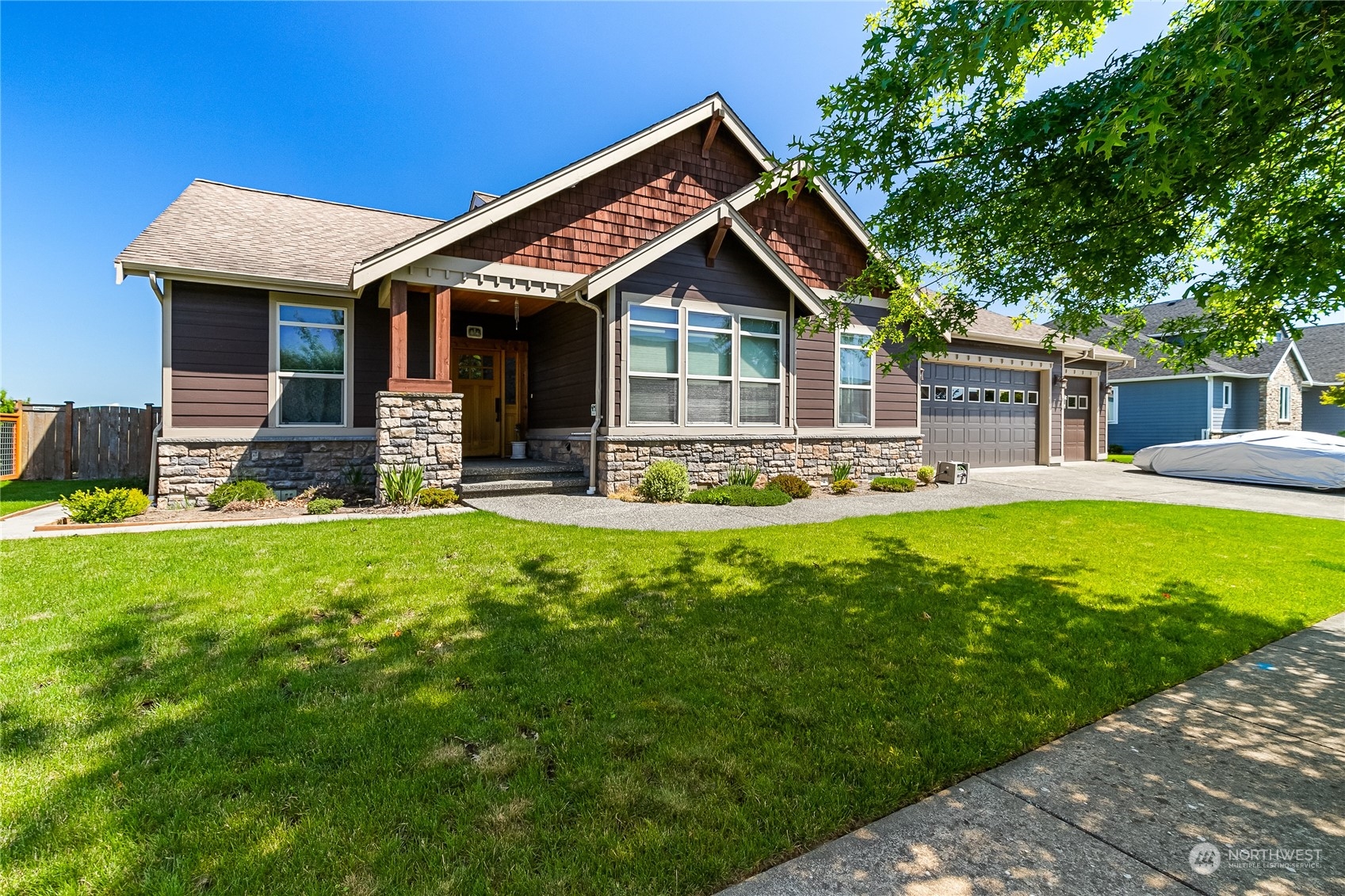 1524 Westview Circle Lynden, WA 98264 - Photo 2 of 30 a front view of a house with a yard table and chairs