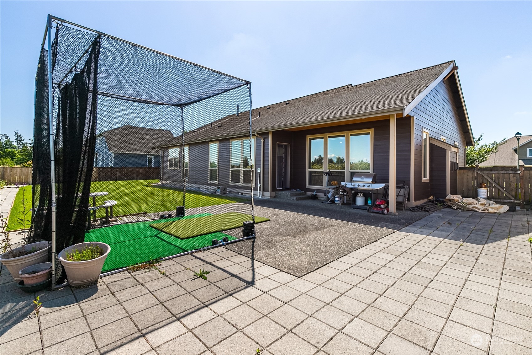 1524 Westview Circle Lynden, WA 98264 - Photo 26 of 30 a view of swimming pool with a lounge chairs in front of house