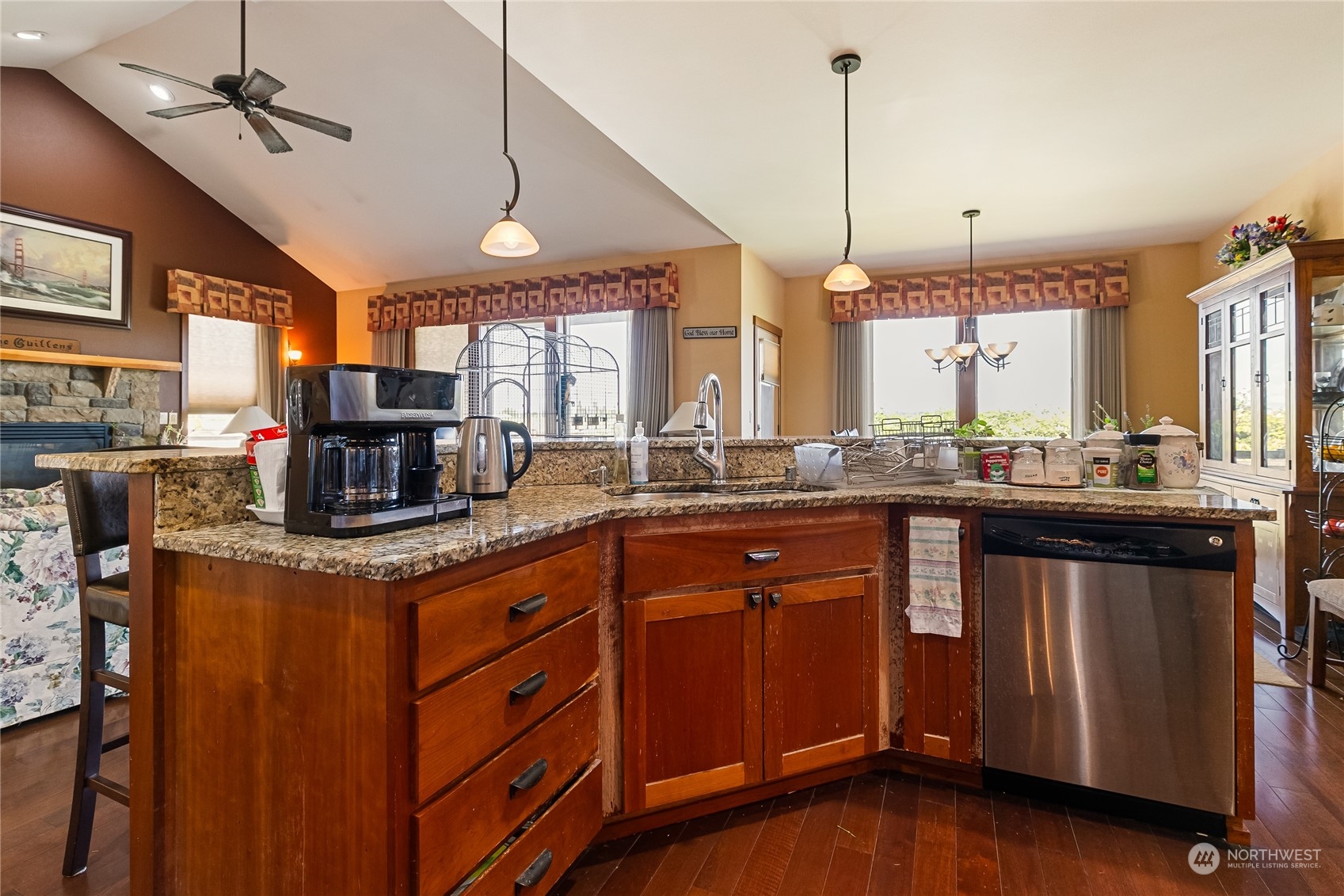 1524 Westview Circle Lynden, WA 98264 - Photo 7 of 30 a kitchen with stainless steel appliances granite countertop a sink a stove and a wooden floor