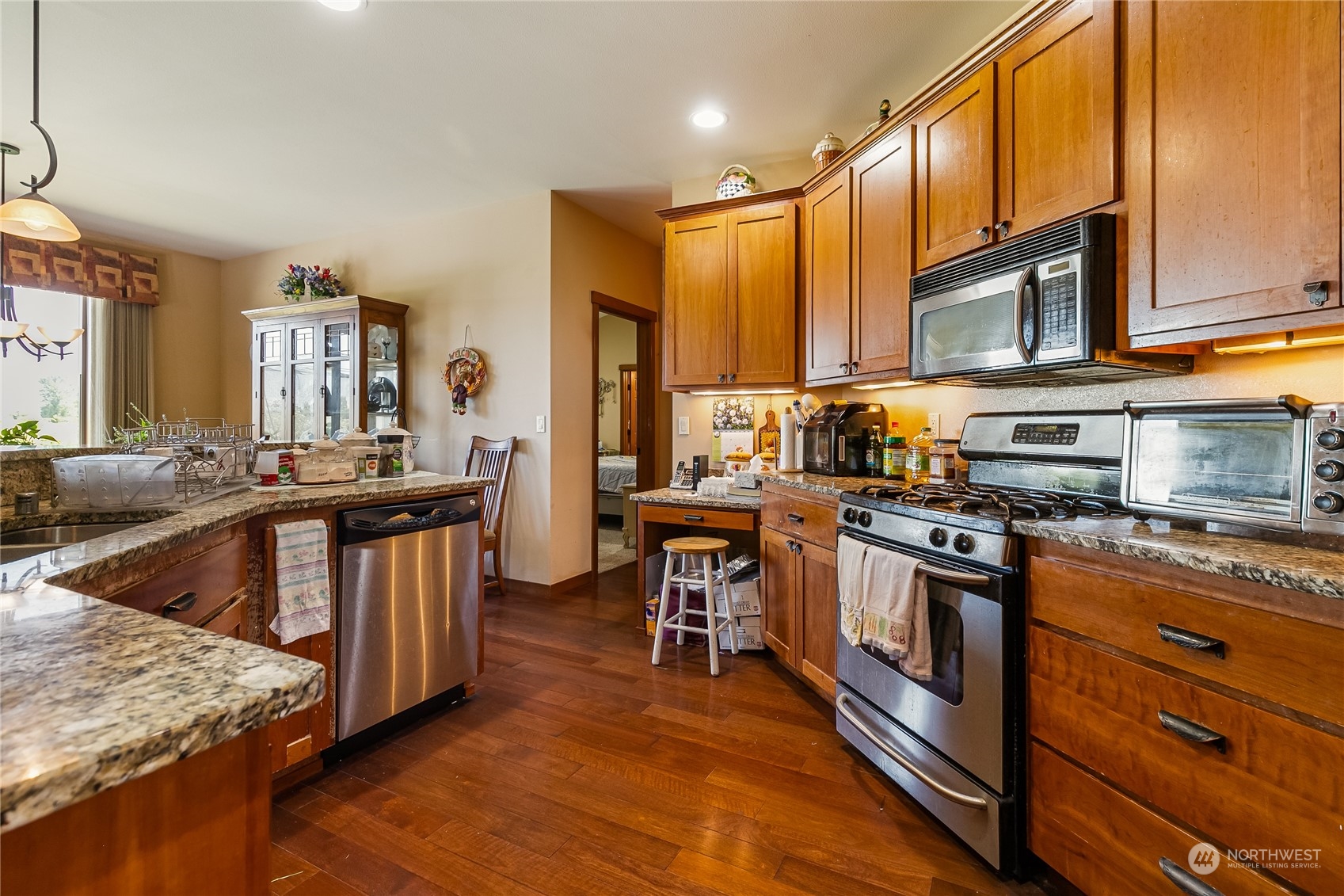1524 Westview Circle Lynden, WA 98264 - Photo 8 of 30 a kitchen with stainless steel appliances granite countertop a stove a sink dishwasher and a refrigerator with wooden floor