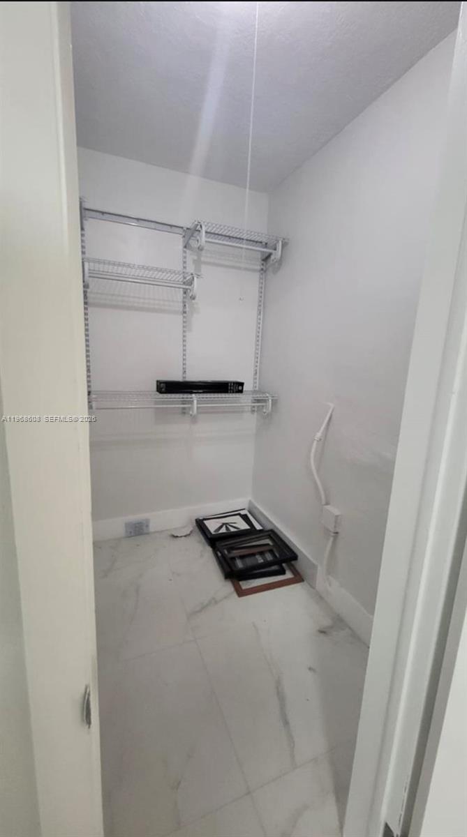 5425 Southwest 77th Court, Unit 102D Miami, FL 33155 - Photo 11 of 22 a walk in closet