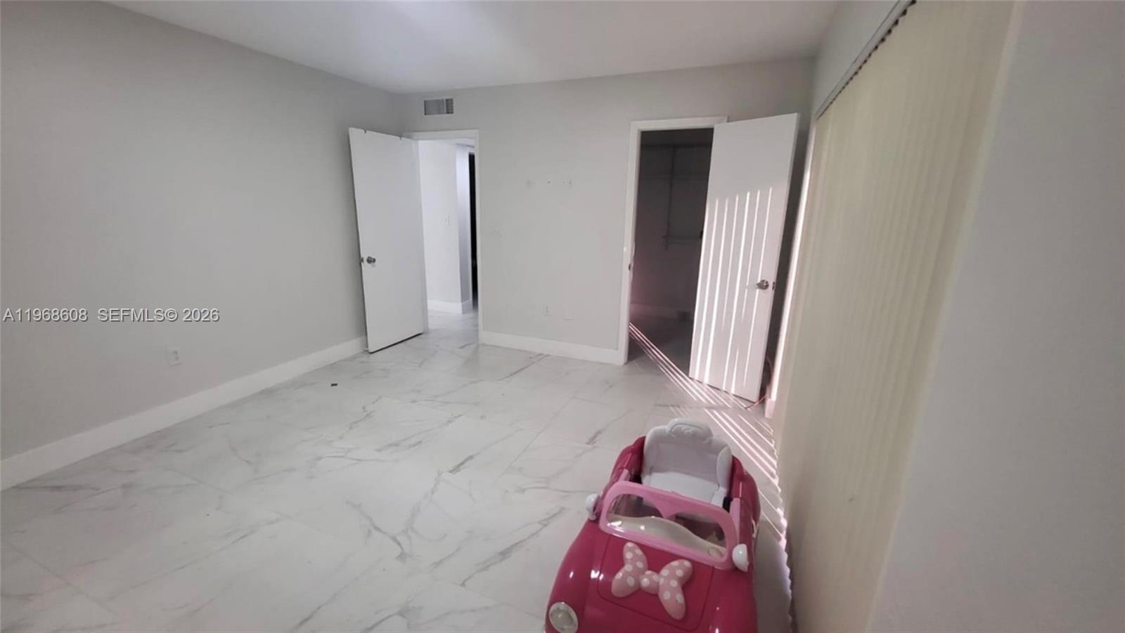 5425 Southwest 77th Court, Unit 102D Miami, FL 33155 - Photo 15 of 22 an entryway and livingroom with furniture