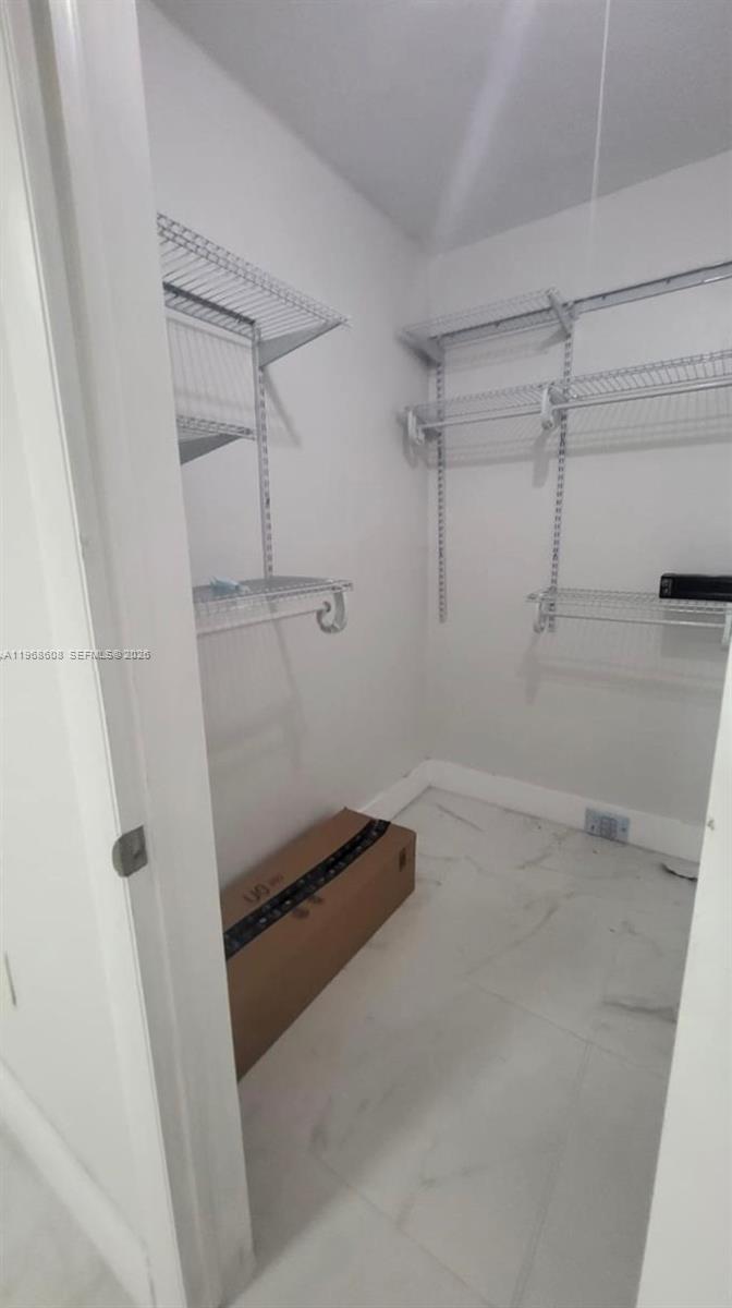 5425 Southwest 77th Court, Unit 102D Miami, FL 33155 - Photo 19 of 22 a bathroom with a shower