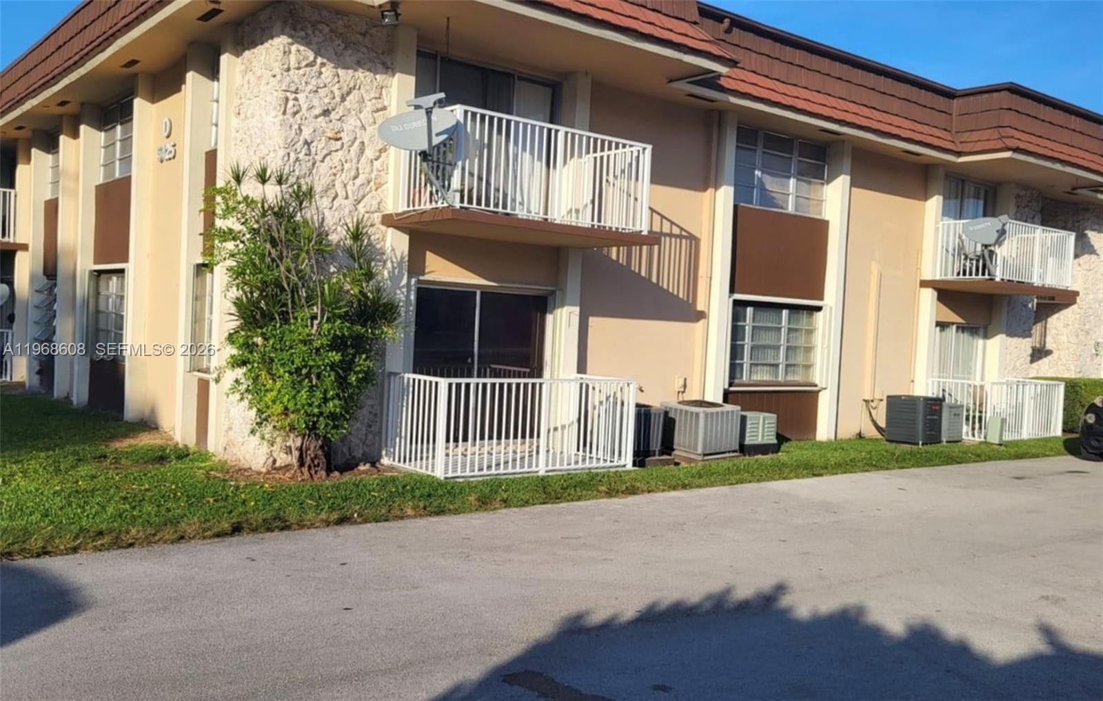 5425 Southwest 77th Court, Unit 102D Miami, FL 33155 - Photo 4 of 22 a view of a house with a yard