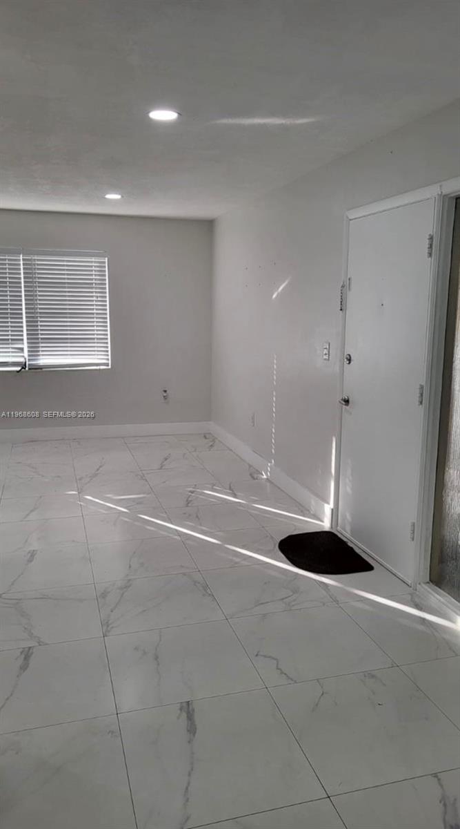 5425 Southwest 77th Court, Unit 102D Miami, FL 33155 - Photo 10 of 22 a view of an empty room