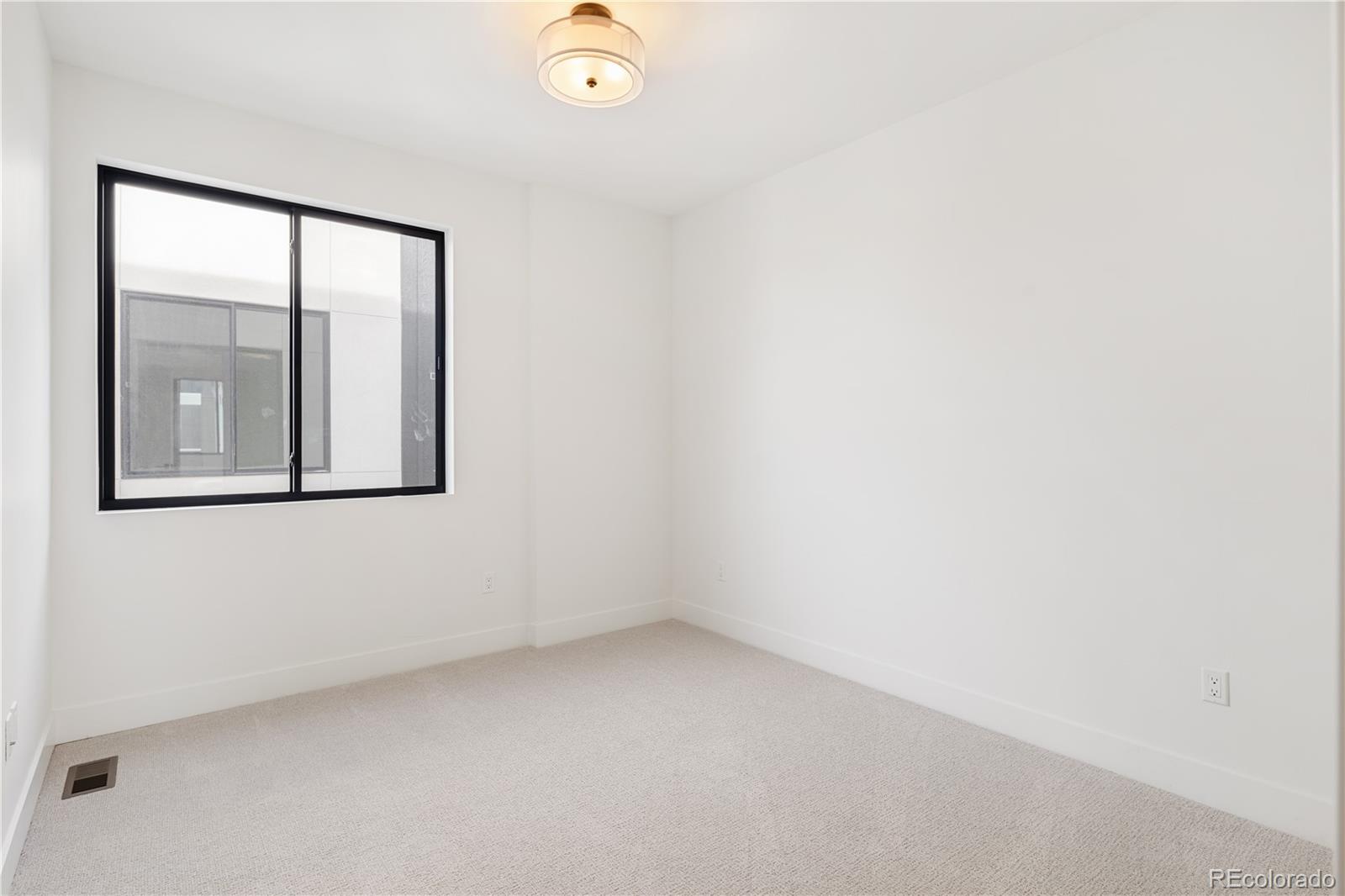 4517 Tennyson Street Denver, CO 80212 - Photo 21 of 28 an empty room with a window