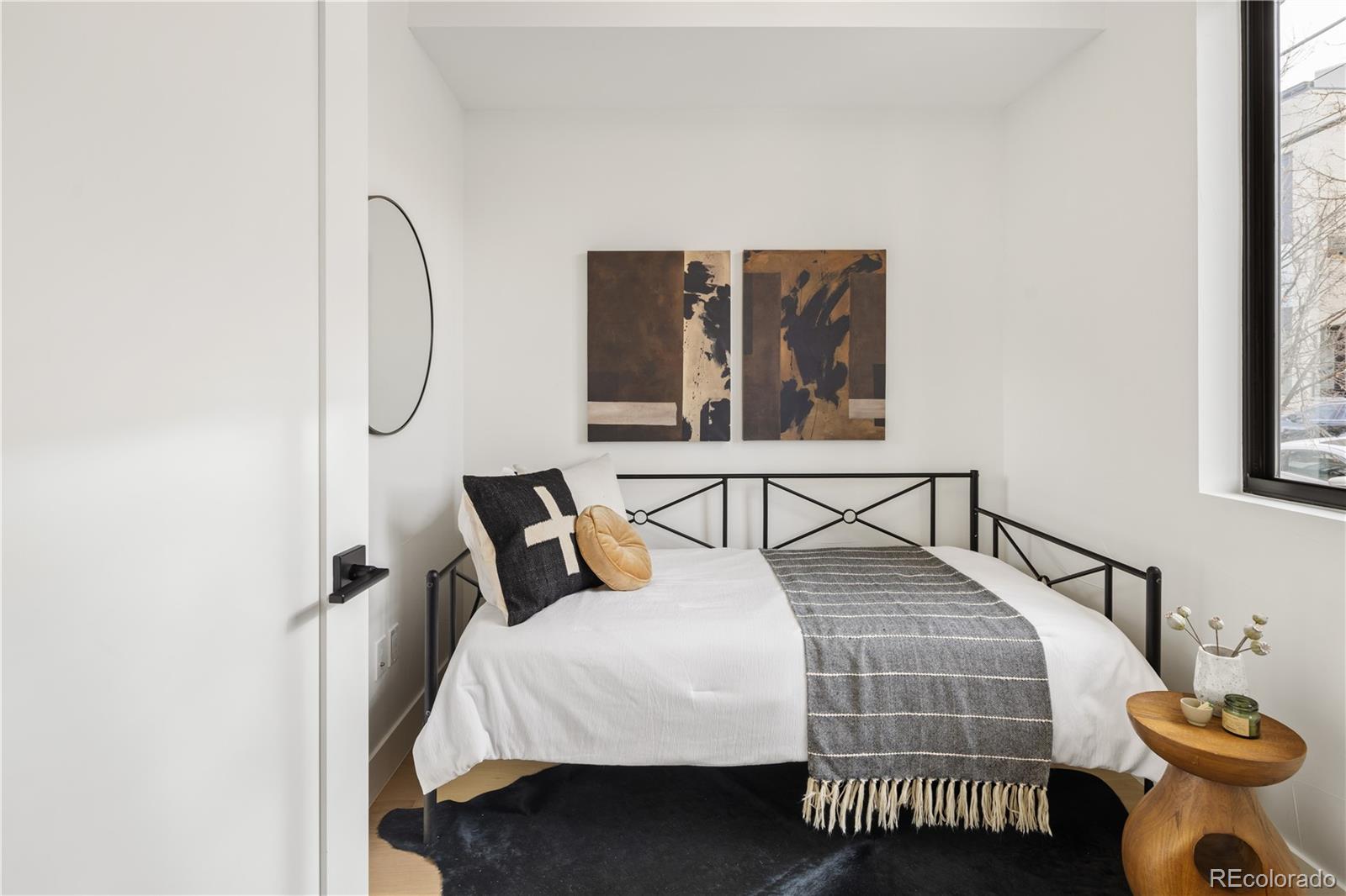 4517 Tennyson Street Denver, CO 80212 - Photo 25 of 28 a bedroom with a bed and window