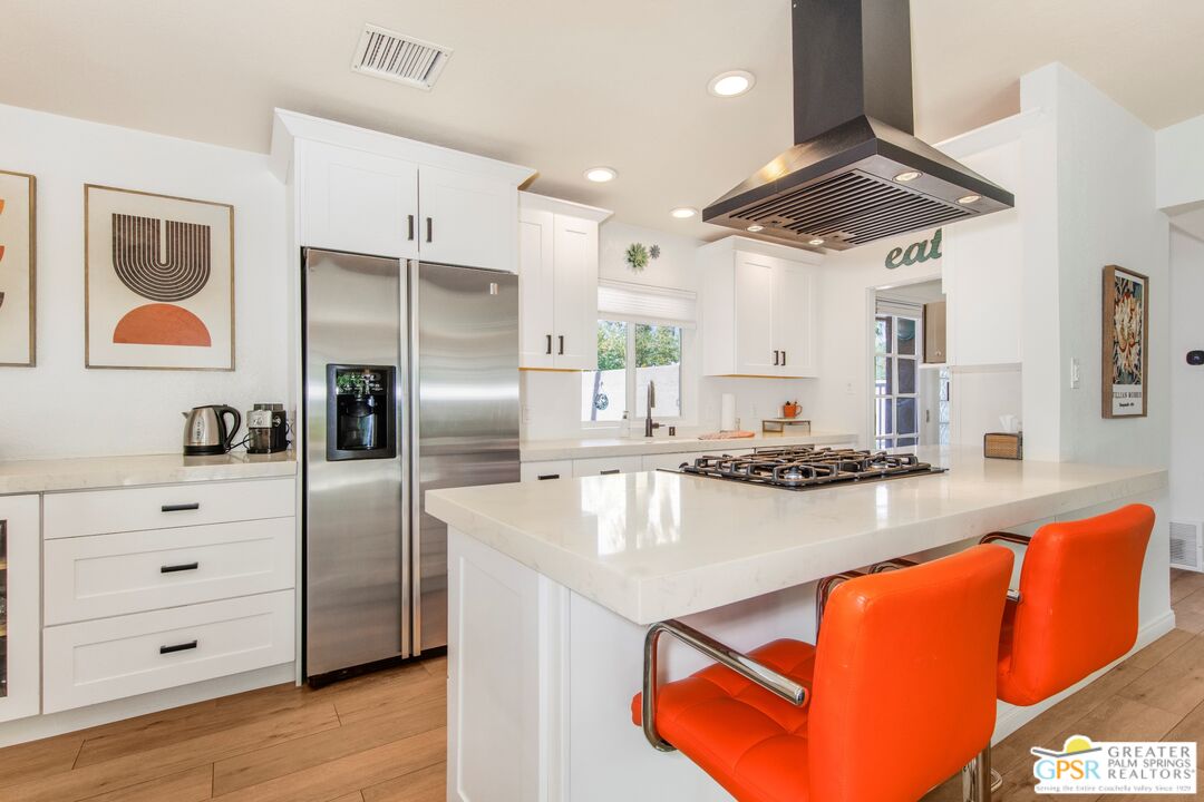 73940 Mountain View Avenue Palm Desert, CA 92260 - Photo 12 of 52 a kitchen with stainless steel appliances granite countertop a sink a stove and a refrigerator