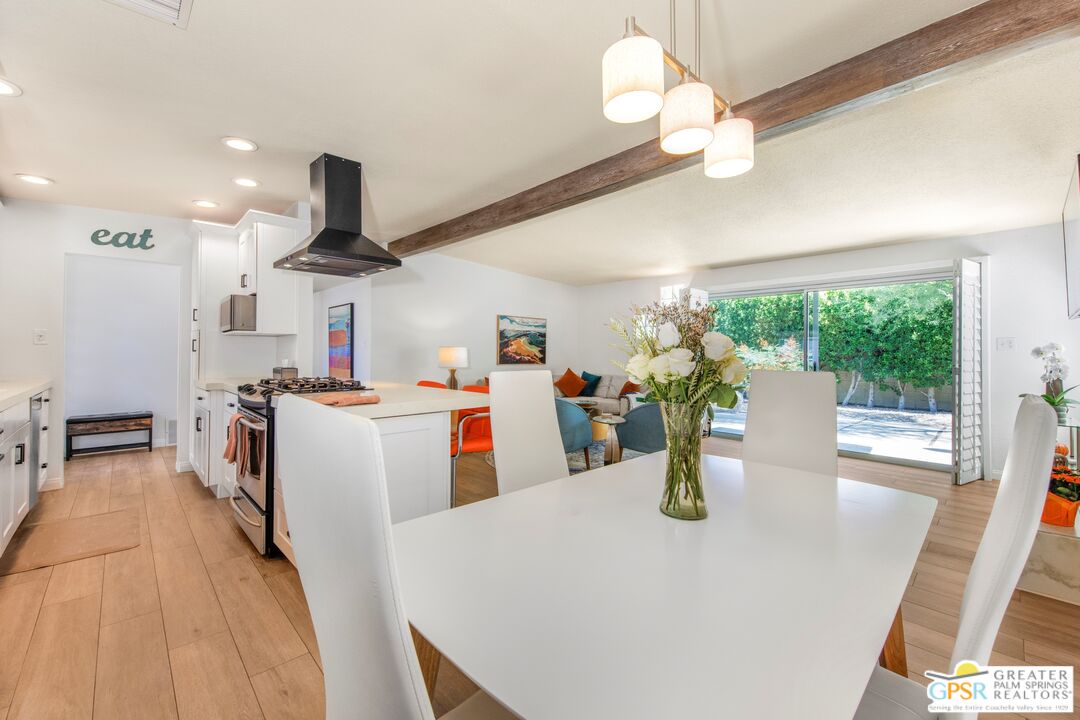 73940 Mountain View Avenue Palm Desert, CA 92260 - Photo 16 of 52 a kitchen and a refrigerator a stove top oven