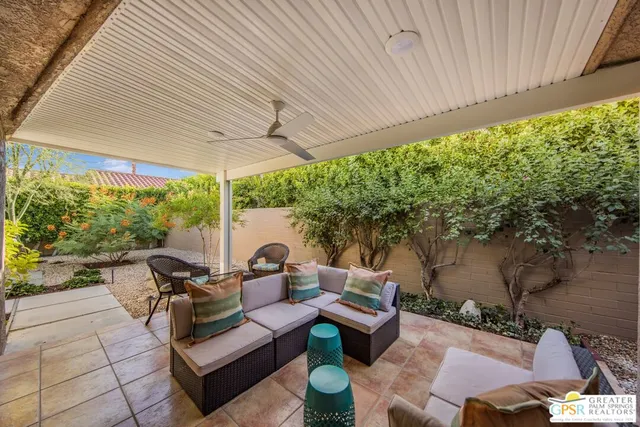 a outdoor living space with furniture and garden view