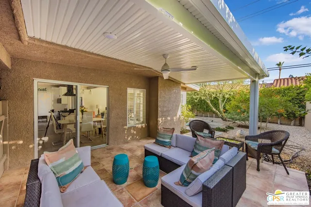 a outdoor space with patio the couches and a dining table with garden view