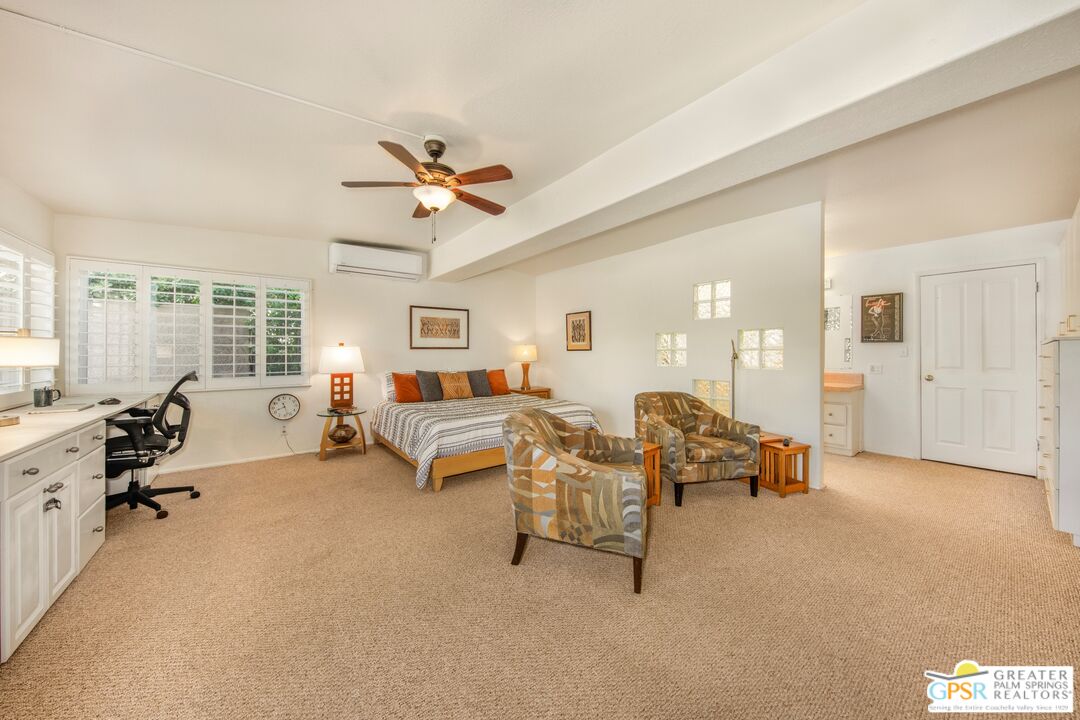 73940 Mountain View Avenue Palm Desert, CA 92260 - Photo 21 of 52 a living room with furniture and a large window