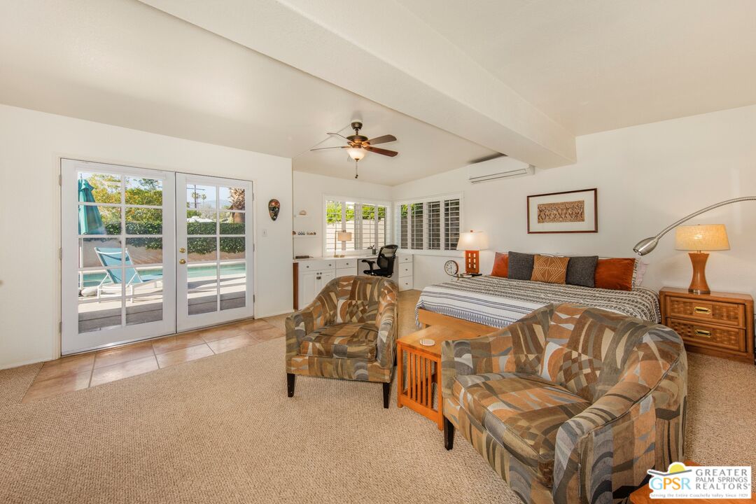 73940 Mountain View Avenue Palm Desert, CA 92260 - Photo 23 of 52 a bedroom with furniture and a large window