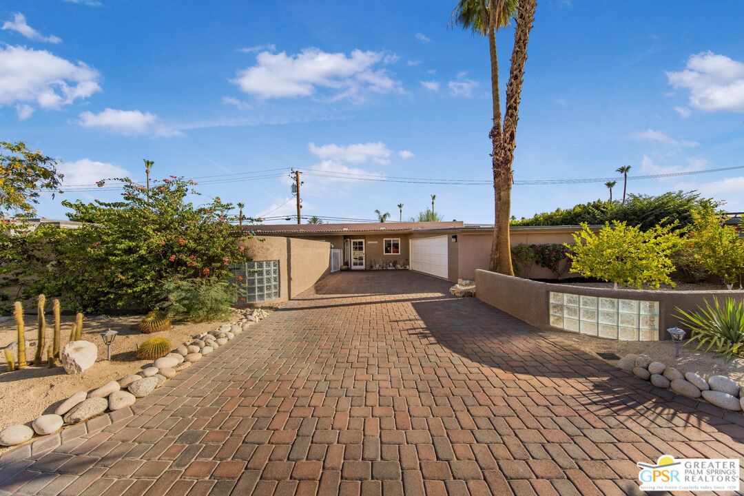 73940 Mountain View Avenue Palm Desert, CA 92260 - Photo 3 of 52 a view of a terrace with wooden fence