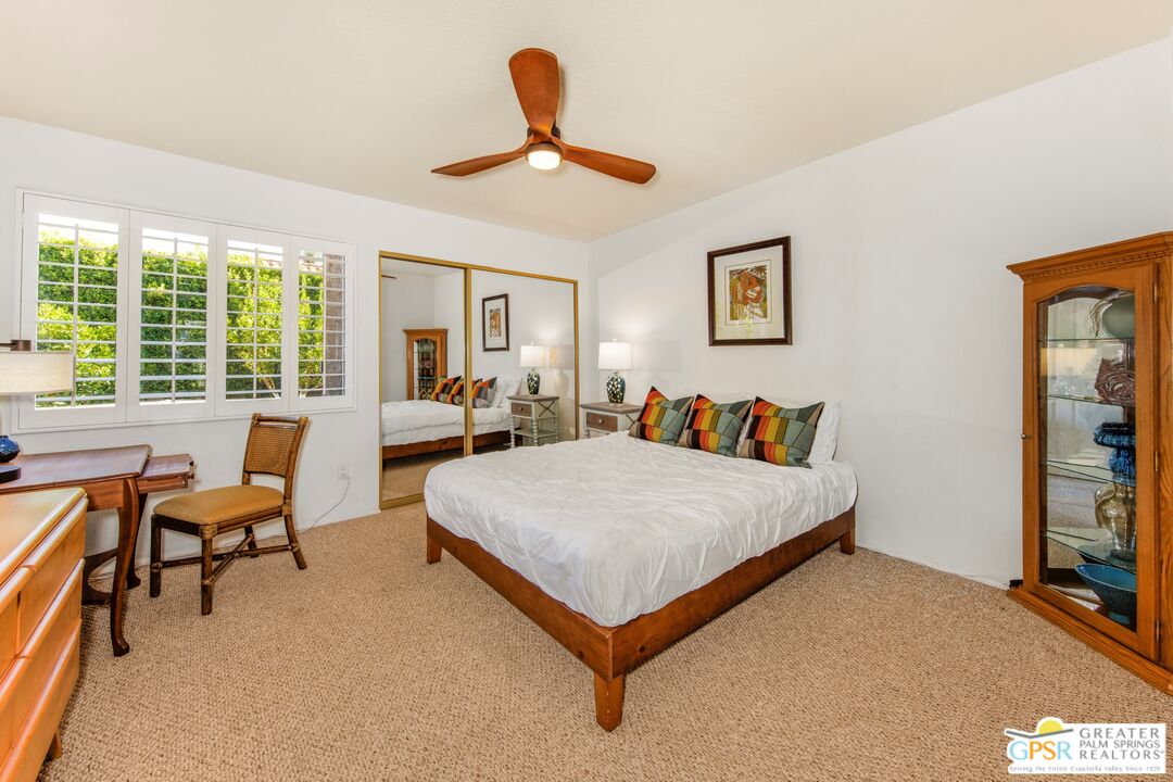 73940 Mountain View Avenue Palm Desert, CA 92260 - Photo 31 of 52 a bed room with a bed and a couch