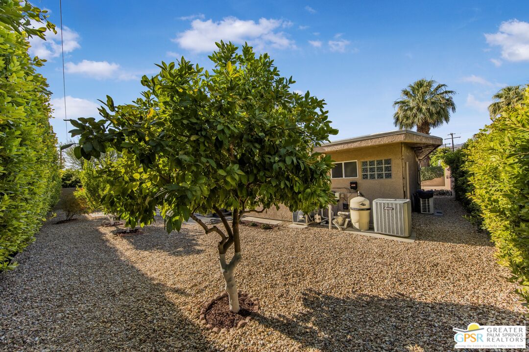 73940 Mountain View Avenue Palm Desert, CA 92260 - Photo 42 of 52 a view of a house with a yard