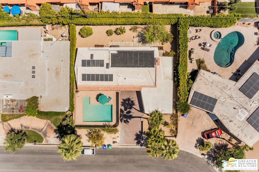 73940 Mountain View Avenue Palm Desert, CA 92260 - Photo 46 of 52 an aerial view of a house with a yard and a car park