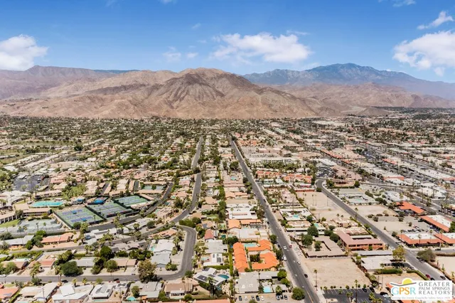 an aerial view of residential house and mountain view