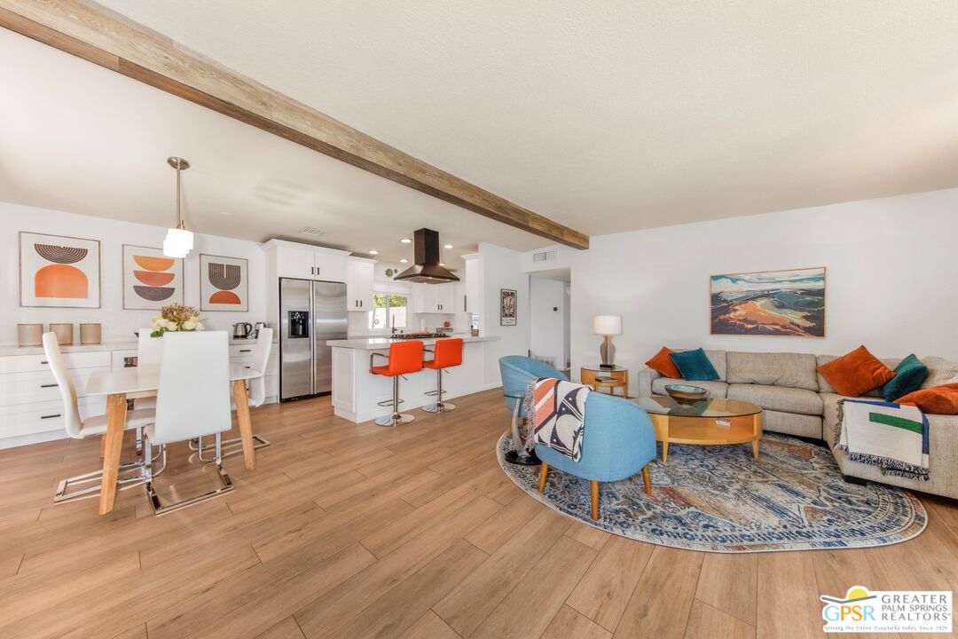 73940 Mountain View Avenue Palm Desert, CA 92260 - Photo 8 of 52 a living room with furniture and kitchen view