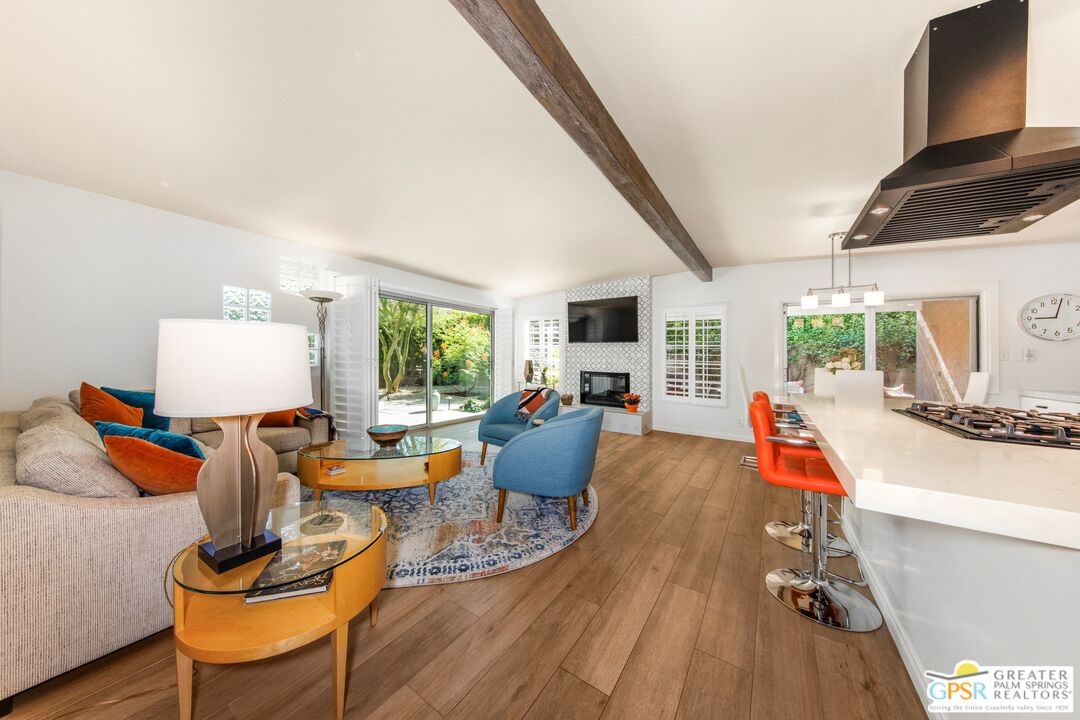 73940 Mountain View Avenue Palm Desert, CA 92260 - Photo 9 of 52 a living room with furniture and a wooden floor