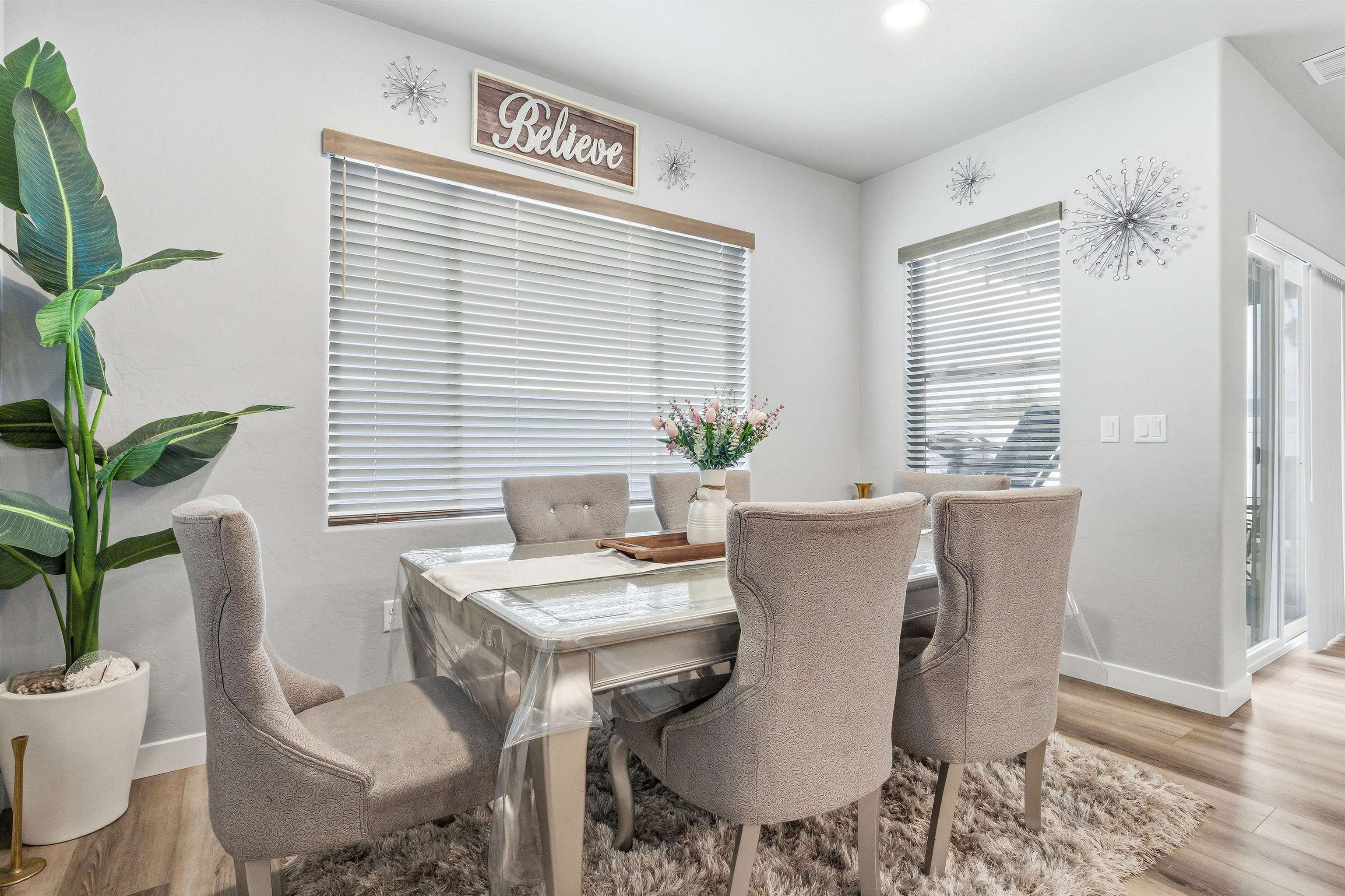 2459 Hamilton Road, Unit A Grand Junction, CO 81505 - Photo 10 of 27 a view of a dining room with furniture and wooden floor