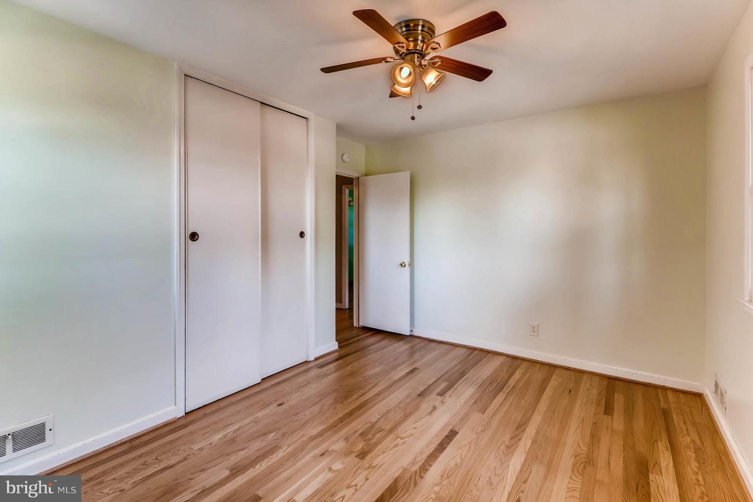 3663 Clifmar Road Baltimore, MD 21244 - Photo 14 of 25 a view of an empty room and wooden floor